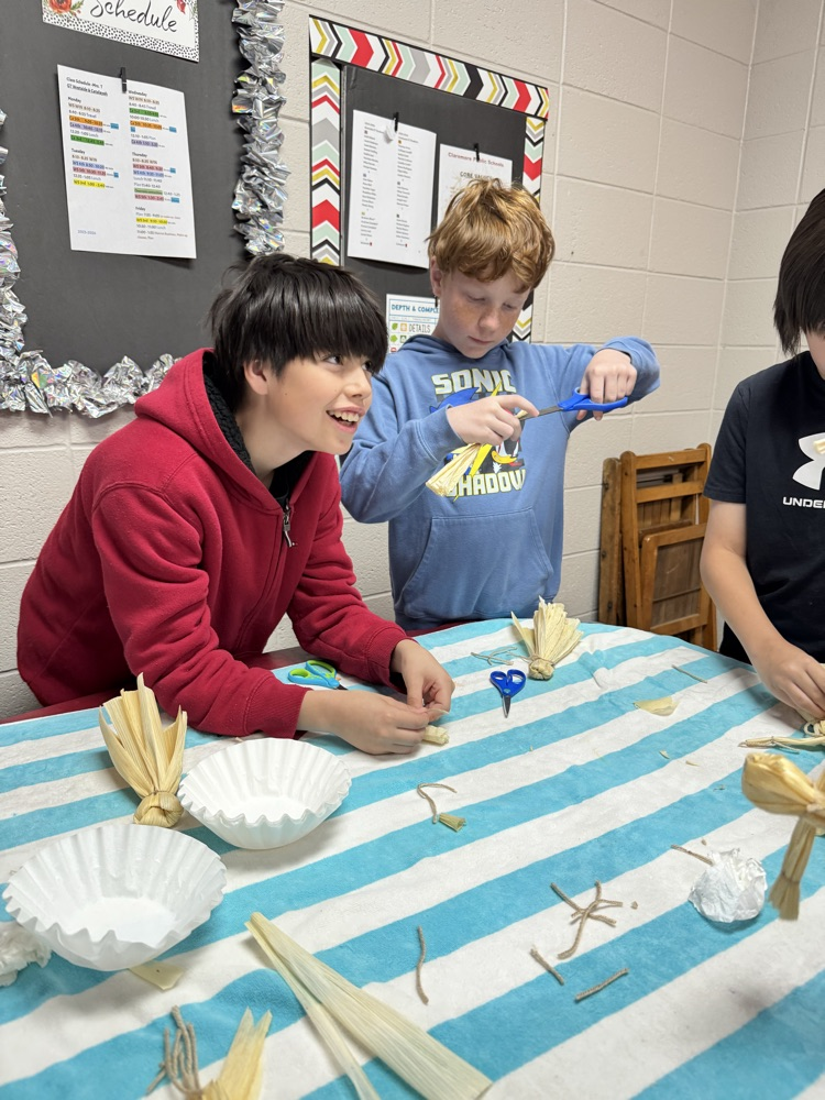 student making corn husks