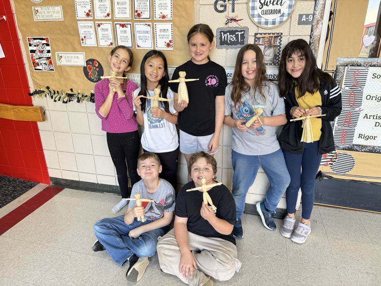 student making corn husks