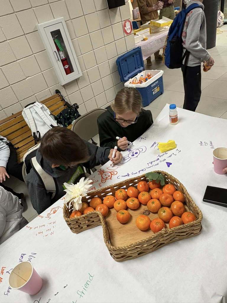 children coloring on the table cloth