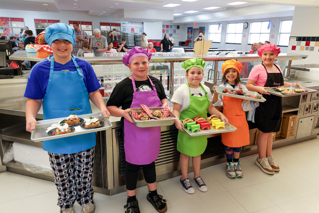 Junior Master Chef Contestants with their dishes. 