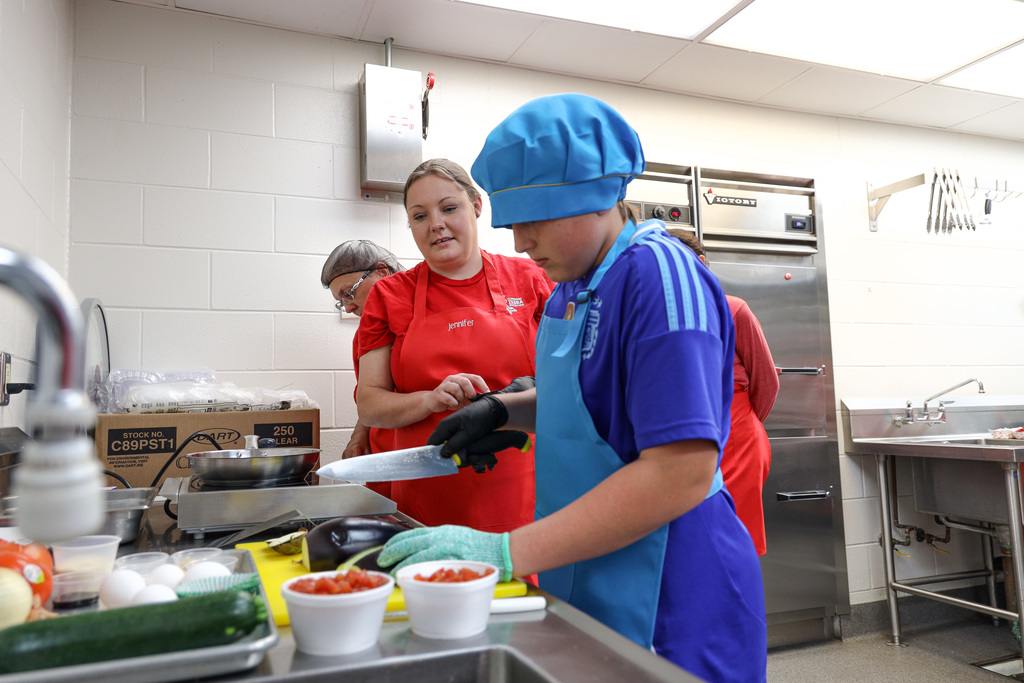 Junior Master Chef Contestants cooking.