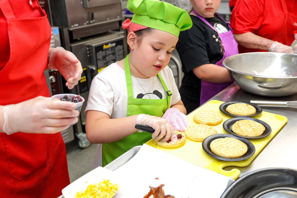 Junior Master Chef Contestants cooking.