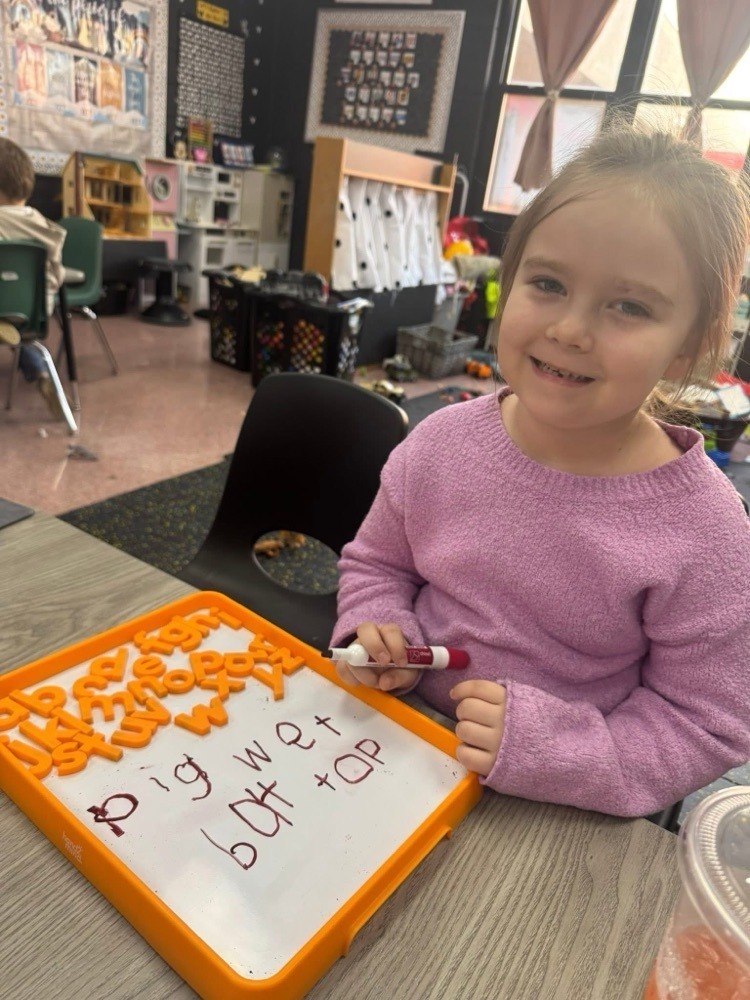 elementary students learning about vowels and consonants.