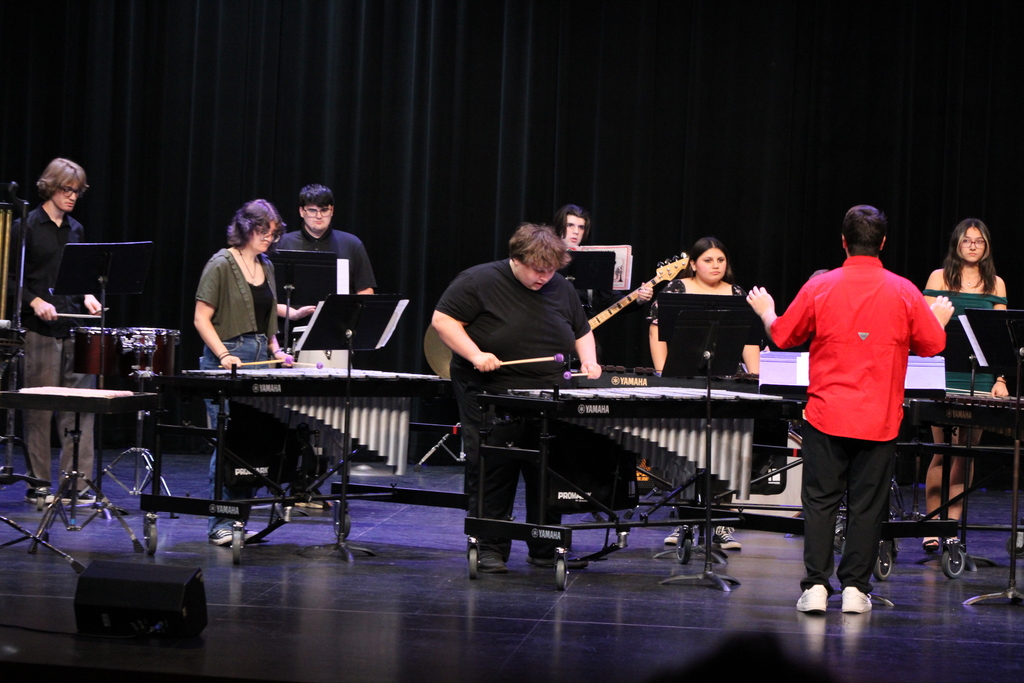 Mr. Downey leading the High school ensemble to close out the show