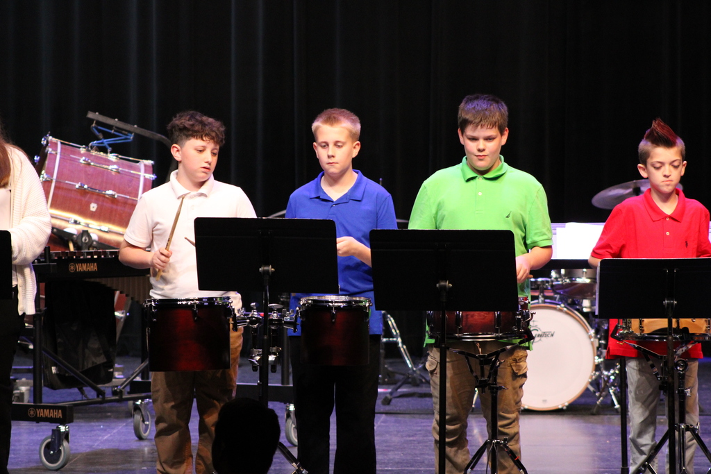 WRJH Percussion in concert playing drums