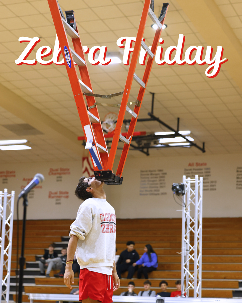 student balancing a ladder on his chin