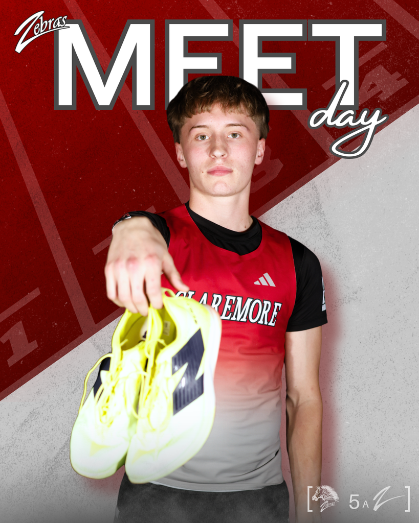 kid in track unifom holding out shoes