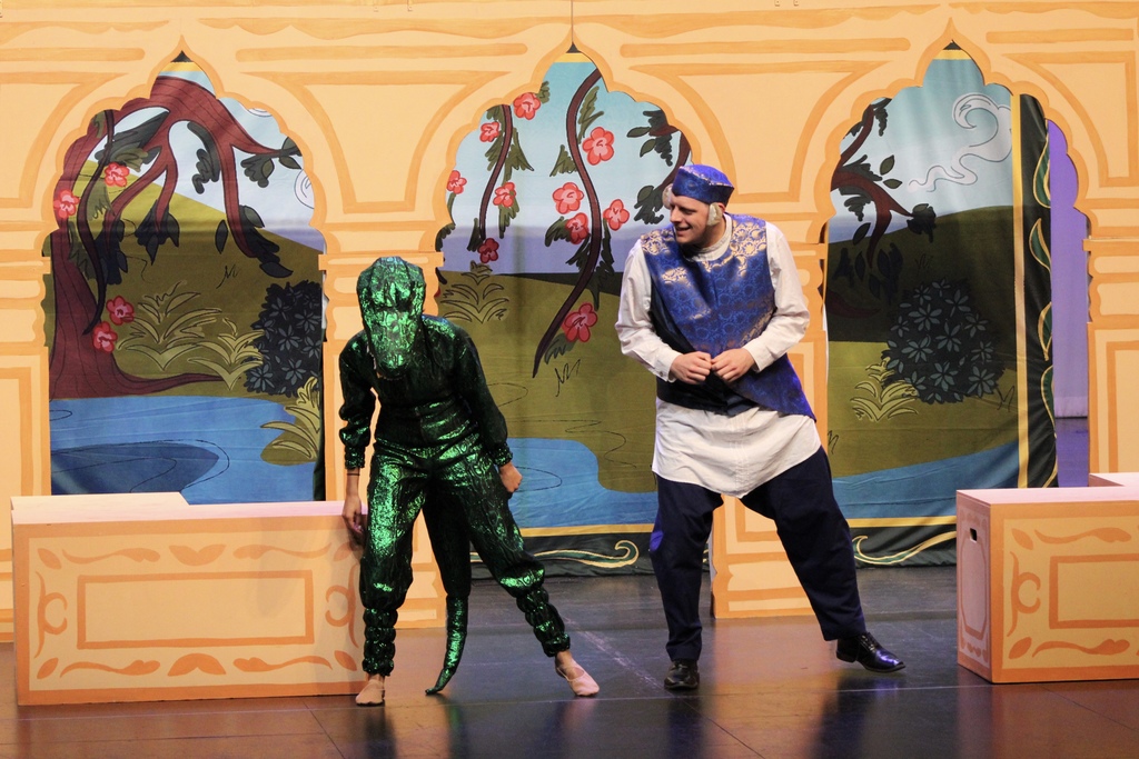 A man dressed up as a monkey and a person dressed up as an alligator for the Tulsa opera show