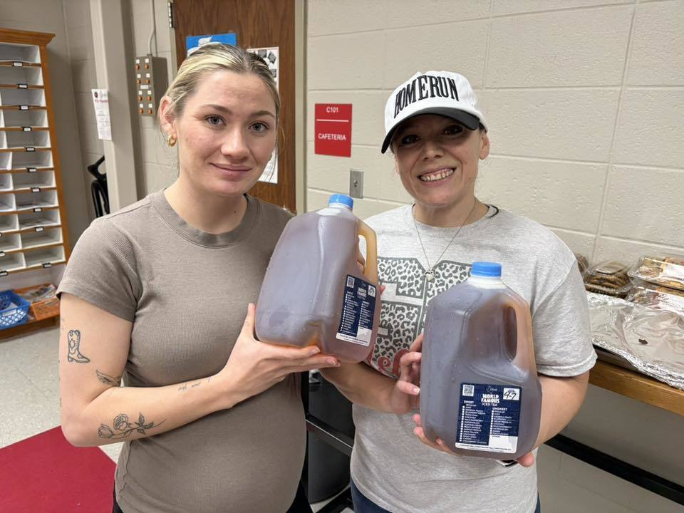maggie and andrea with tea gallons
