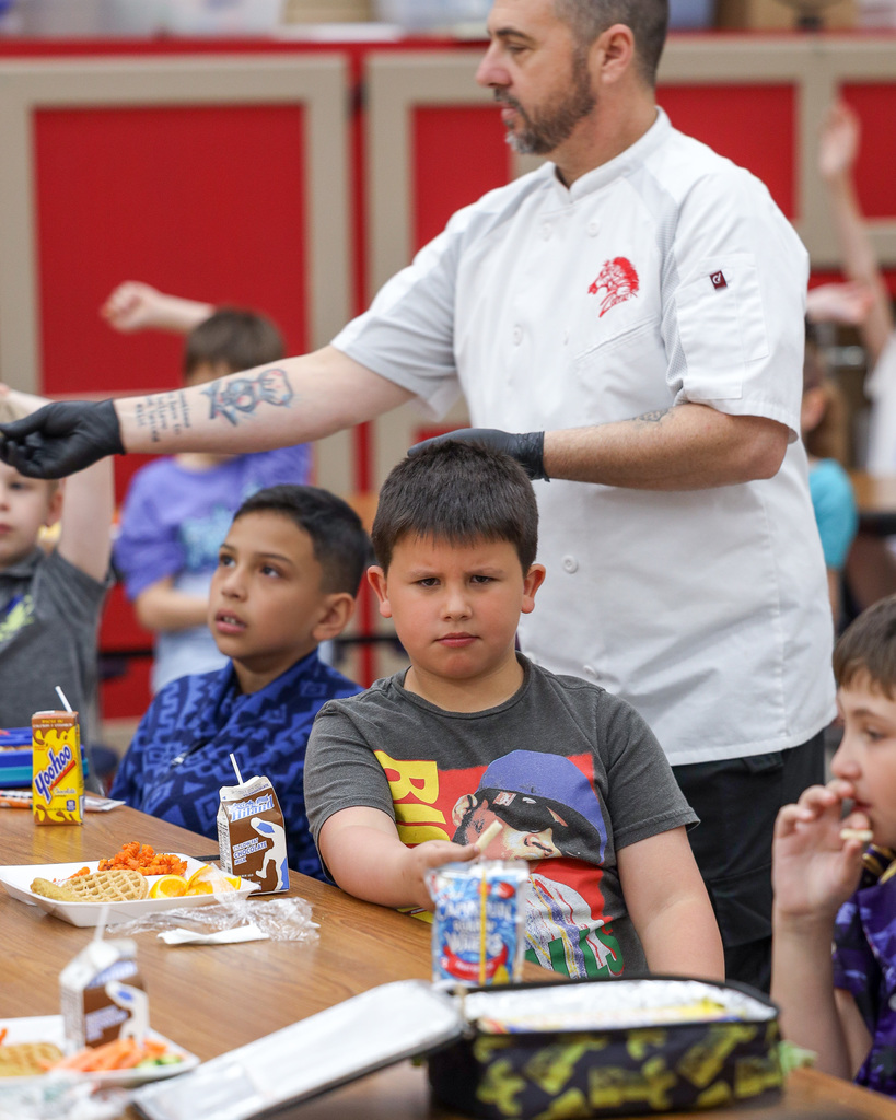 Elementary students trying Jicama