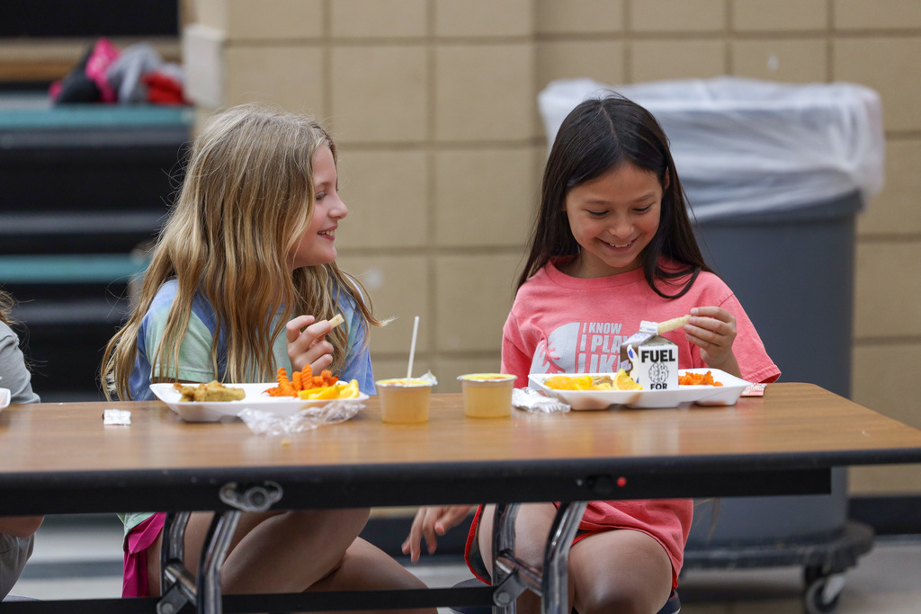 Elementary students trying Jicama