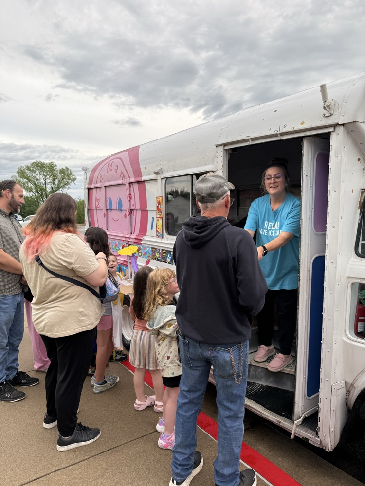 families waiting in line for food