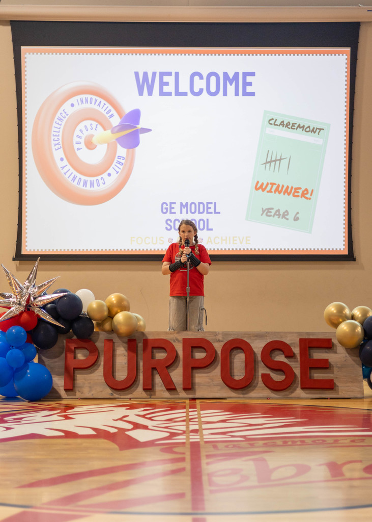 Student speaking at assembly