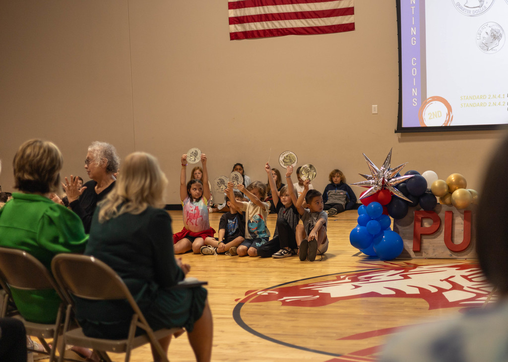 Student speaking at assembly