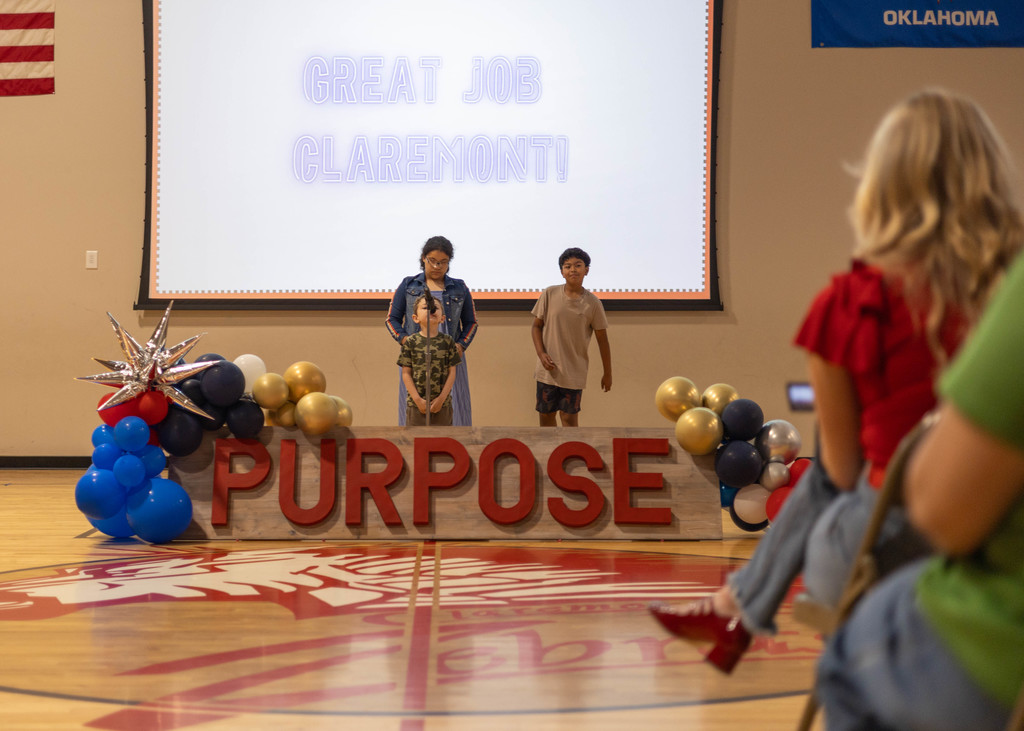 Student speaking at assembly