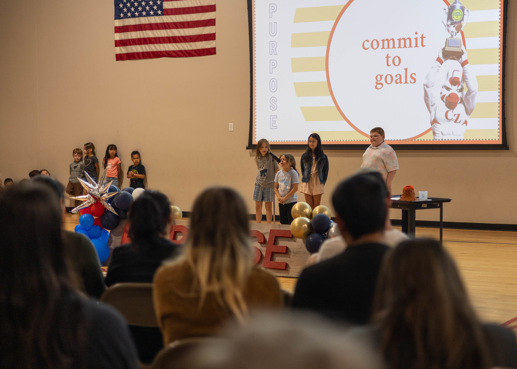 Student speaking at assembly