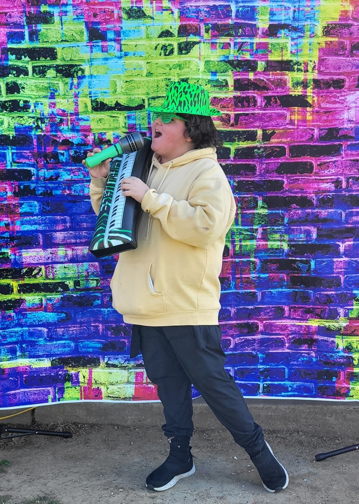 student pretending to sing