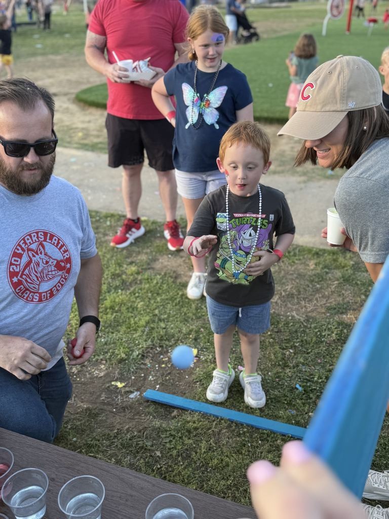 student playing game at carnival