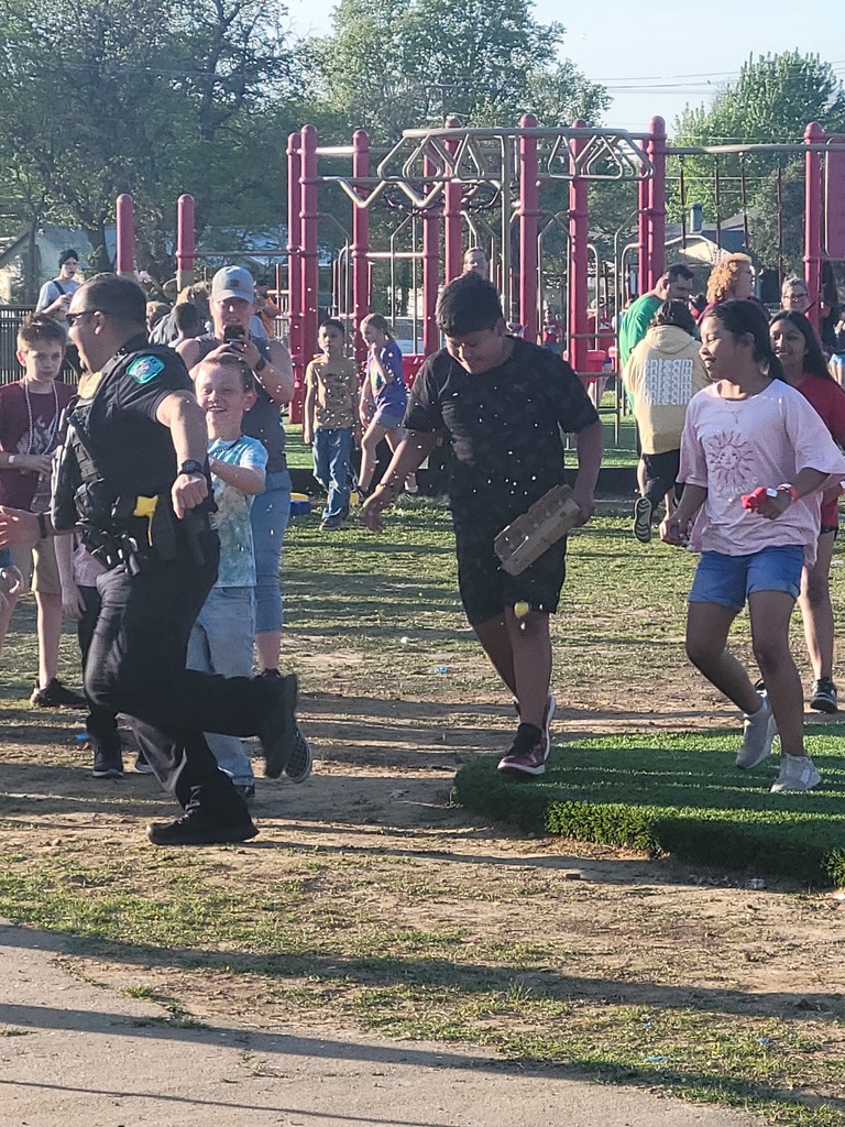 students chasing officer rice