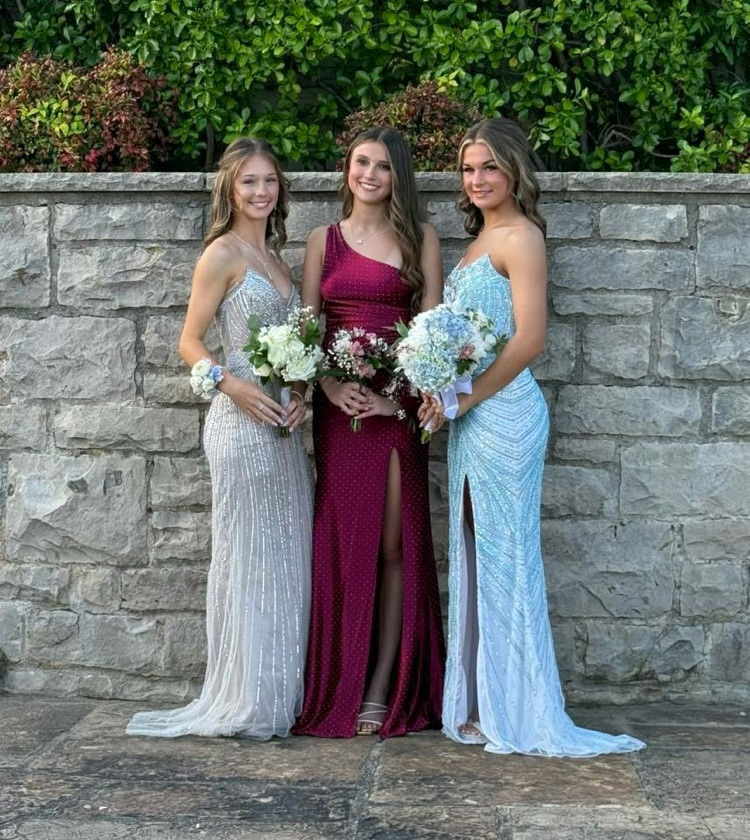 group of three girls in their prom dresses
