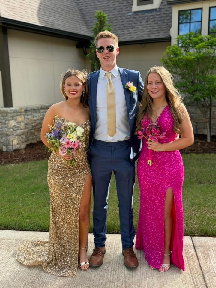 group of three students smiling for photo