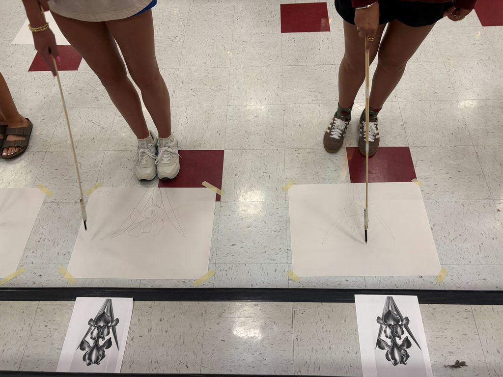 Students drawing their art challenge piece during an art class at CHS.