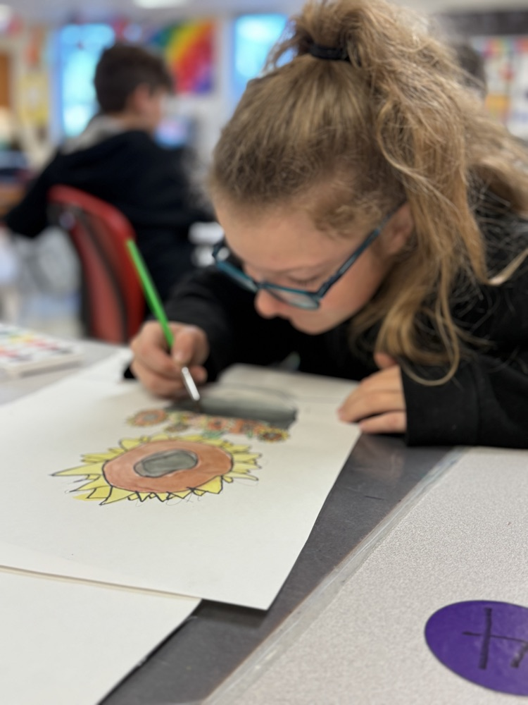 Student focused on her art work.
