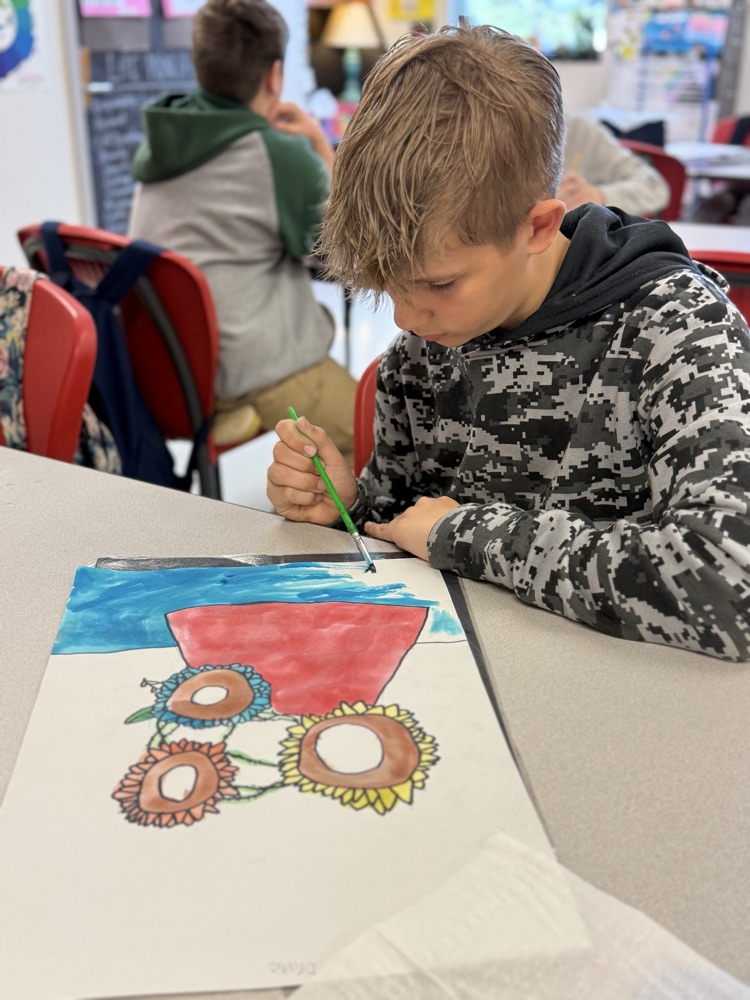Catalayah student working on a painting
