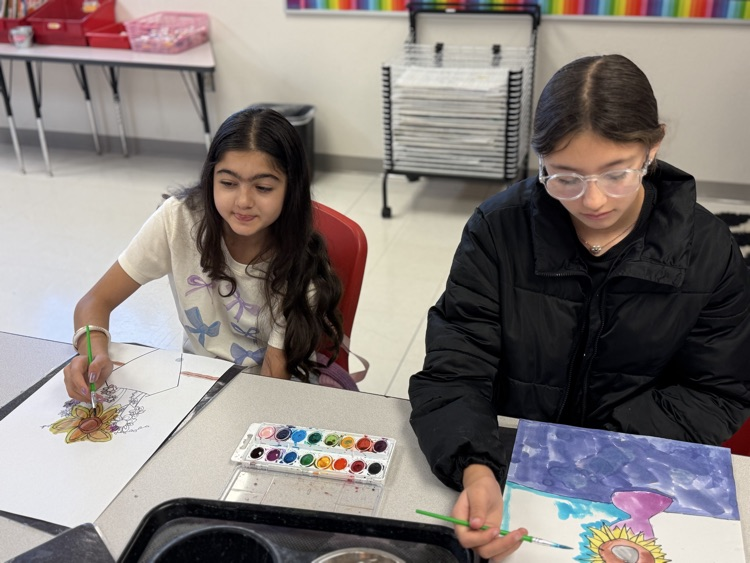 Students focused and enjoying art class.