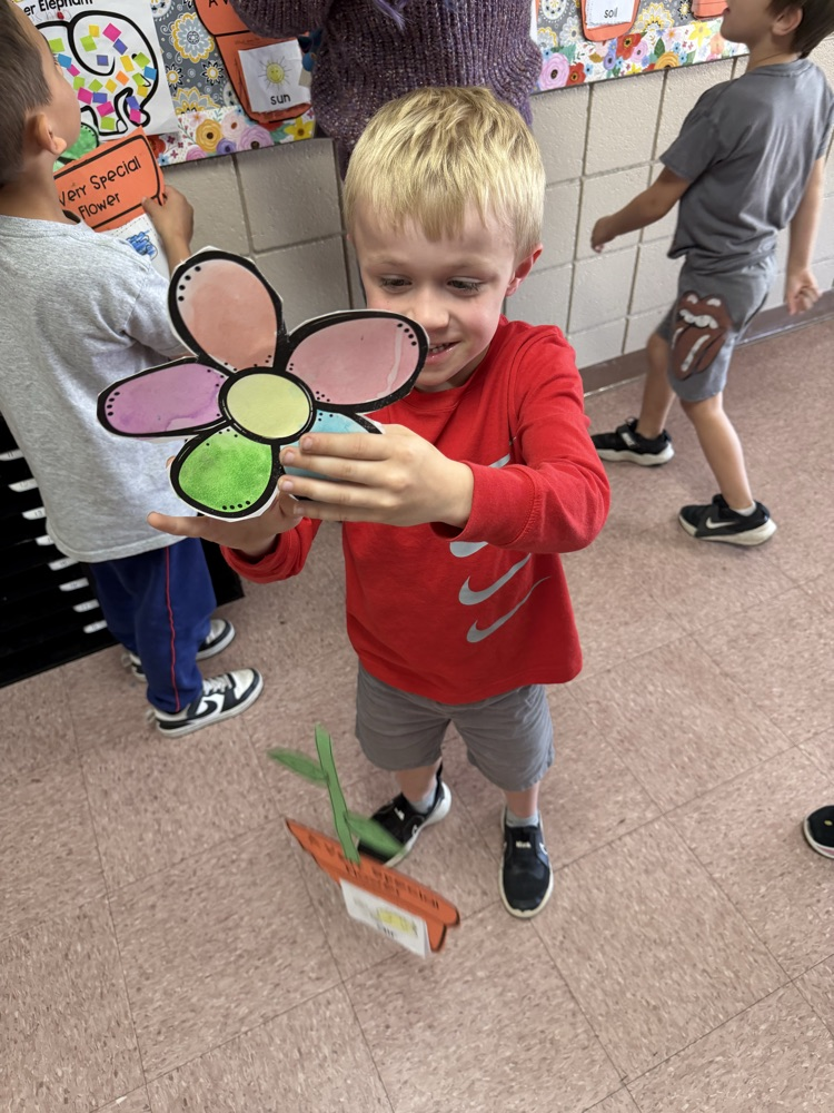 student with plant coloring sheet 