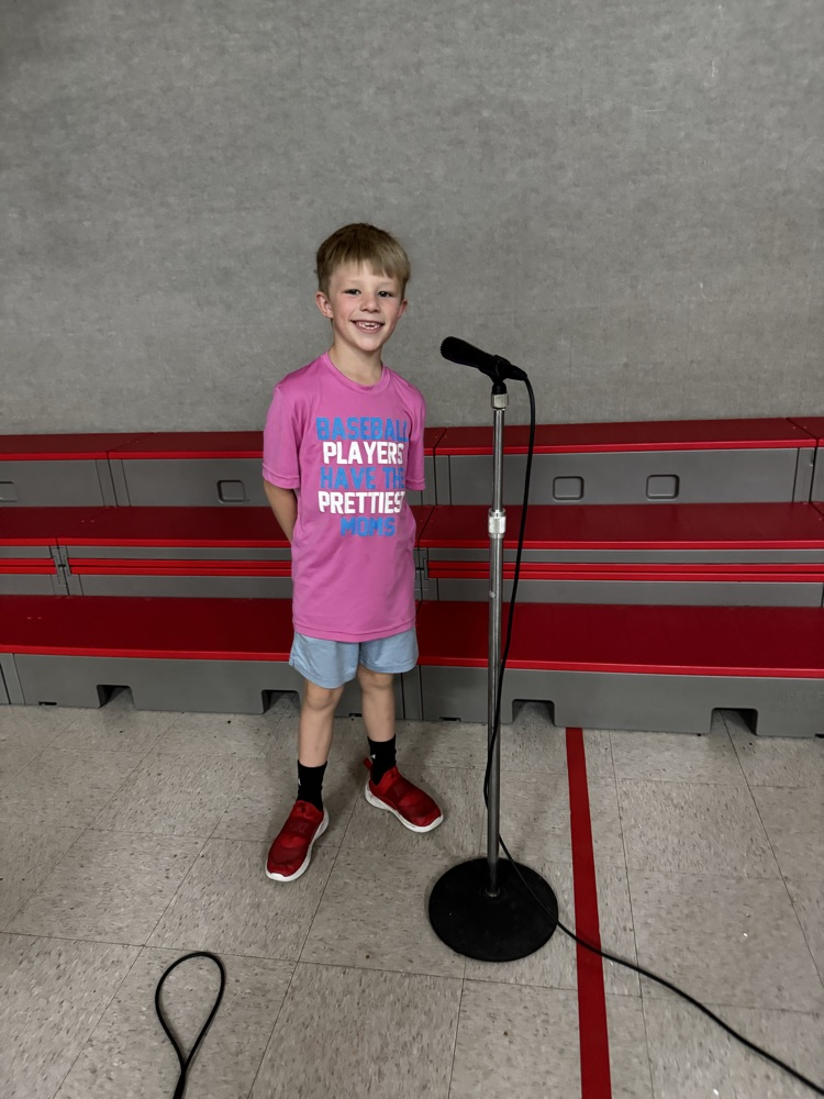 students speaking into microphone