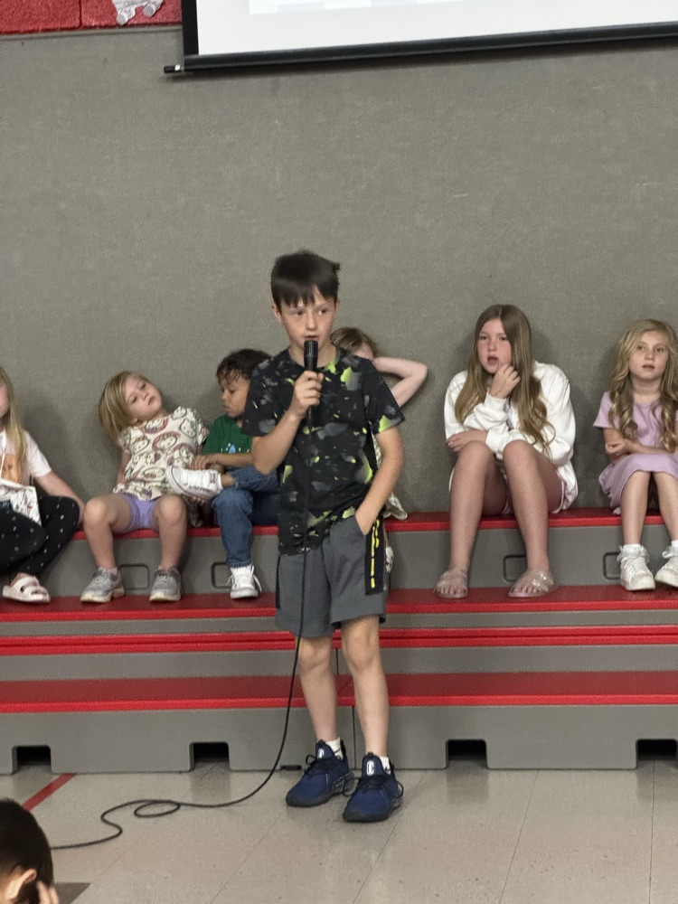 students speaking into microphone