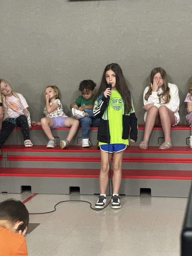 students speaking into microphone