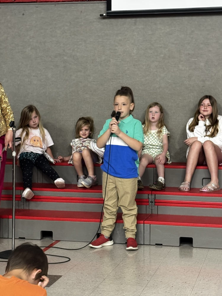 students speaking into microphone