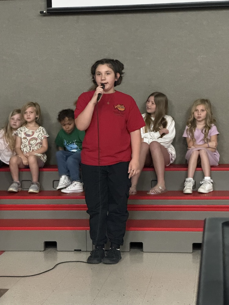 students speaking into microphone