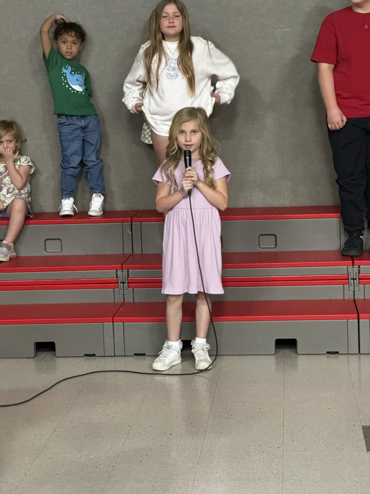 students speaking into microphone