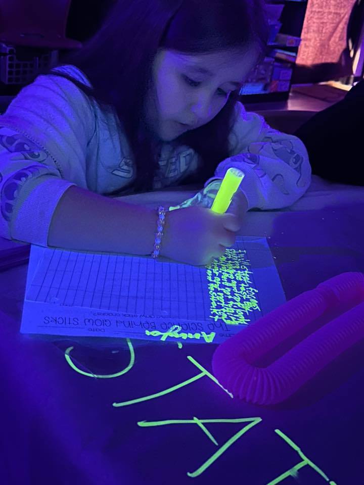 students participating in the glow party