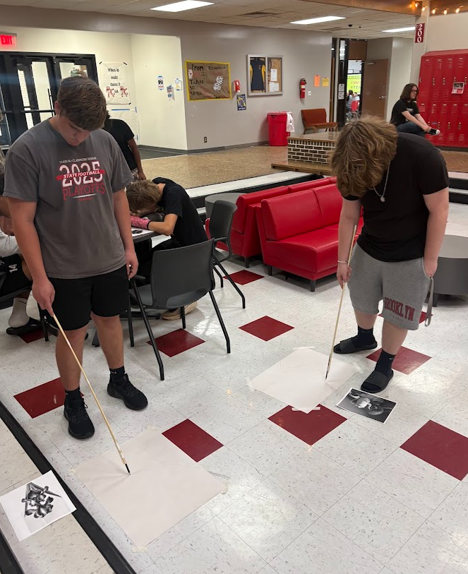 We tried something a little different in the art room 🎨  Students were challenged to create drawings using pencils attached to long sticks instead of holding them in their hands. With that added distance, every line became less about precision and more about movement, gesture, and trusting the process.  It started off feeling awkward (and a little frustrating), but that’s where the magic happens. When perfection isn’t possible, creativity takes over. Students loosened up, took risks, and embraced the “mess”—and the results were incredible. 👏