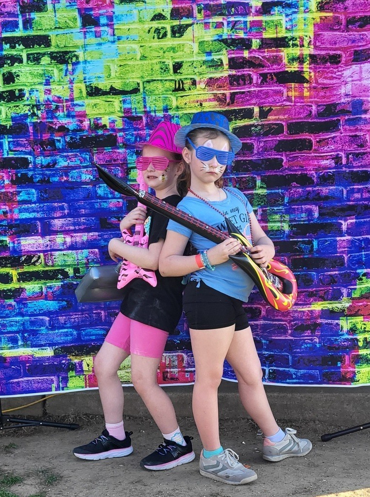 Claremont students posing for a photo at the Claremont Carnival.