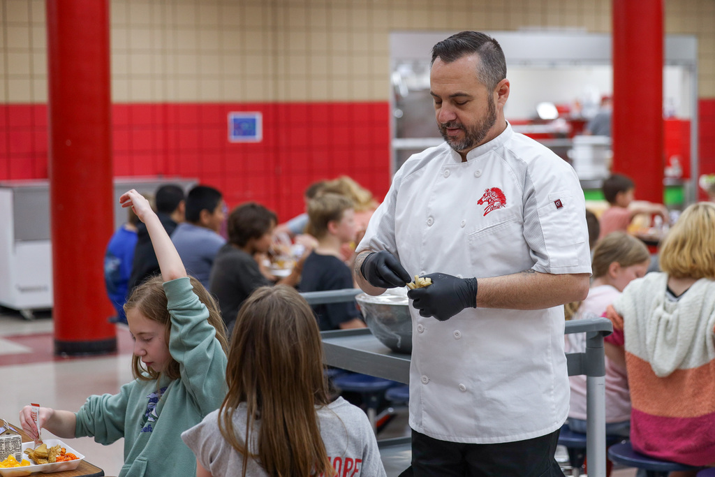 Chef Ryan passing out try day foods