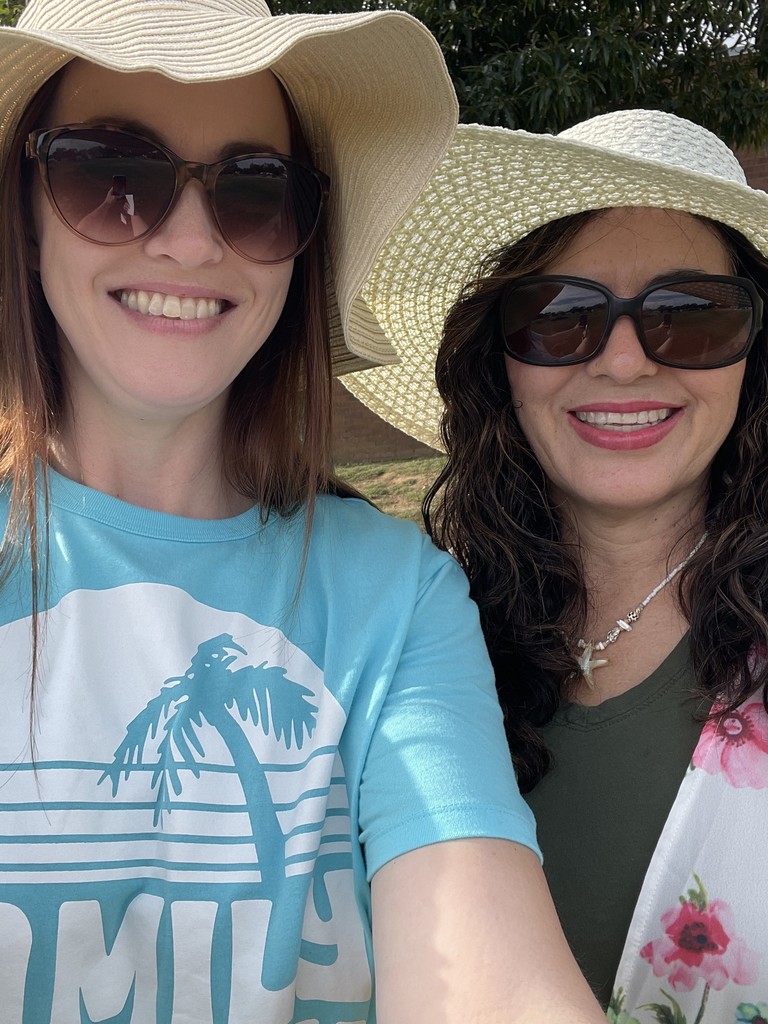 staff in beach day attire, smiling