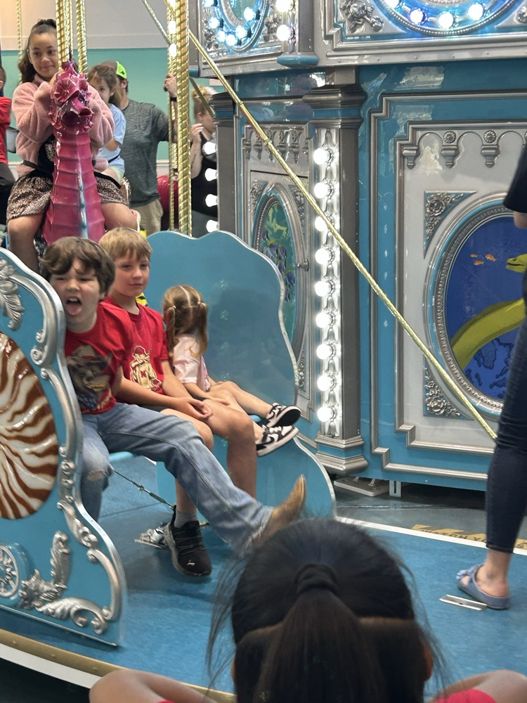 students on carousel 