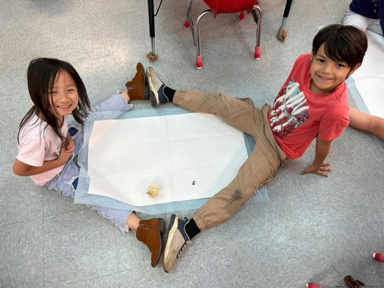 students playing with chick 