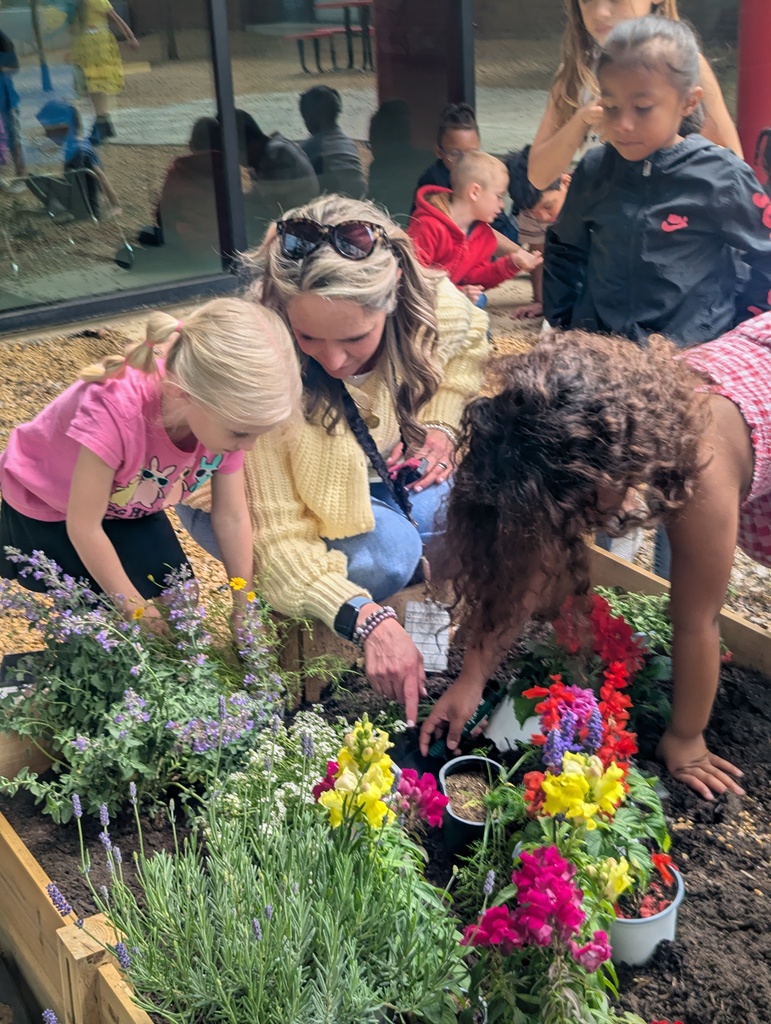 student helping in the garden
