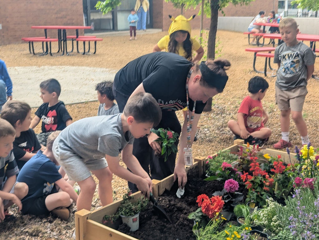 student helping in the garden