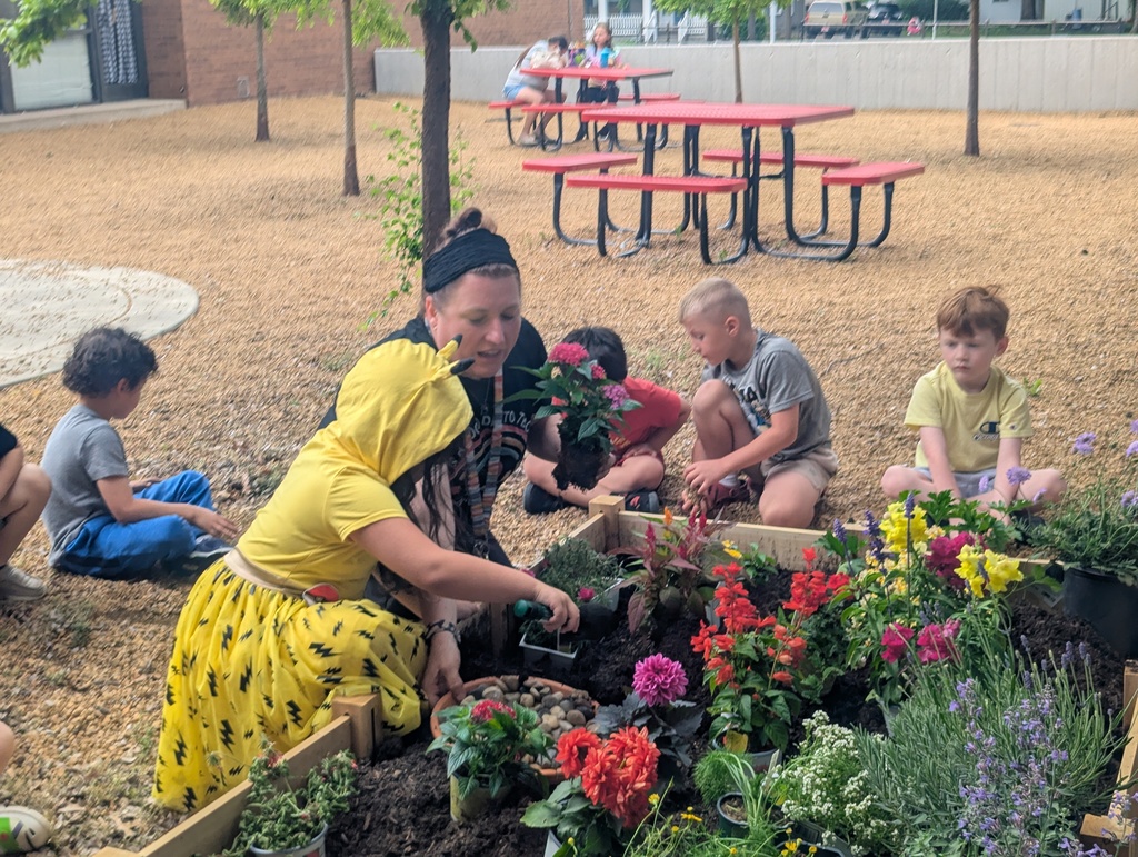 student helping in the garden