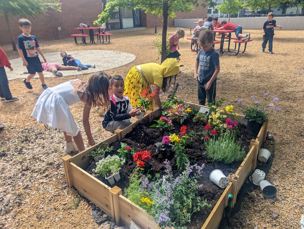 student helping in the garden