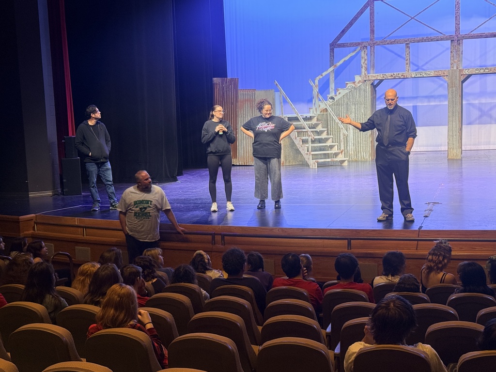 Directors of Footloose the Musical giving the kids a pep talk before the show.
