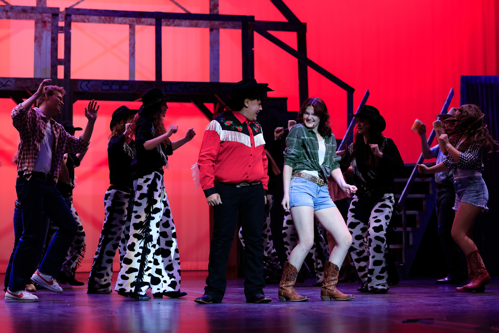 High school students performing Footloose.