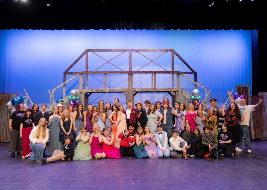 Footloose cast and crew group photo on stage